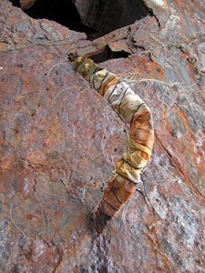 Tapa-wrapped frame hung high