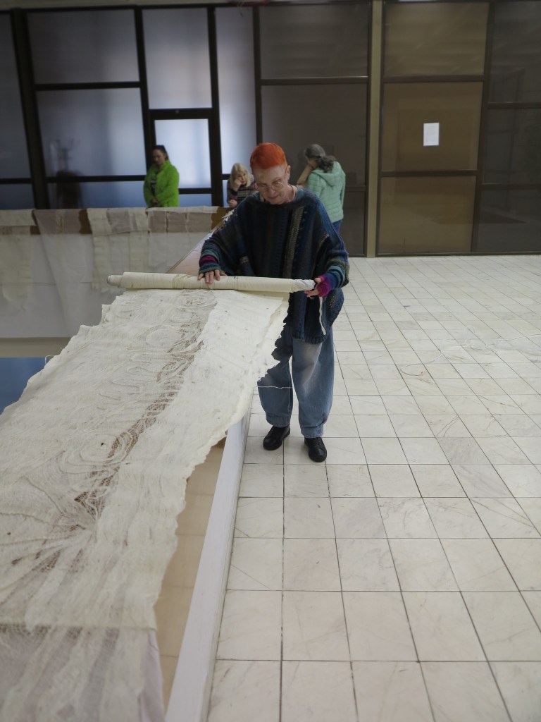 Andrea opening the lace panels