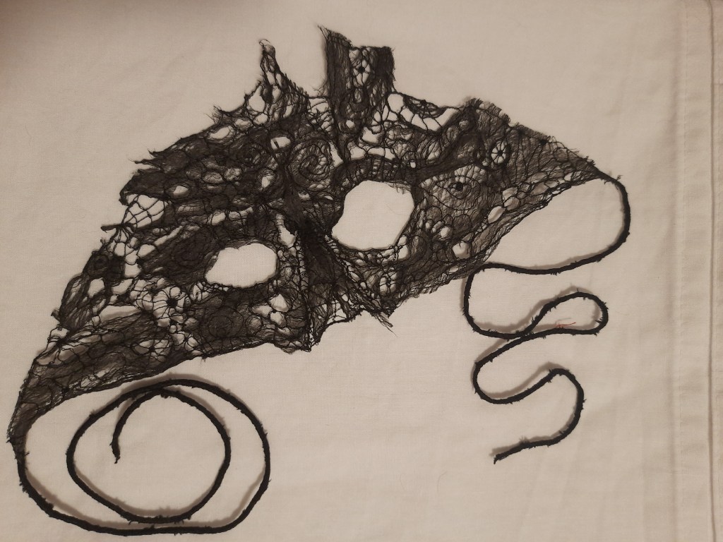 Black tapa and lace mask