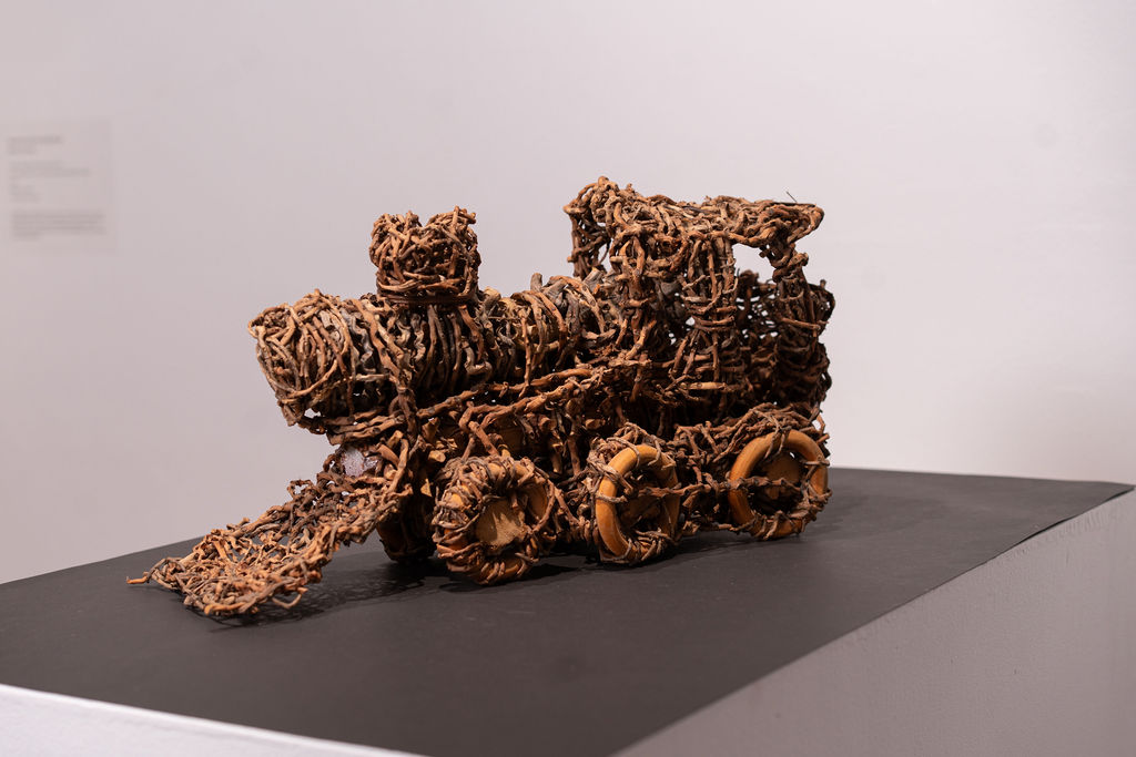 Janine McAullay-Bott, Train Engine, 2011, palm fronds, palm branch, kurrajong seed pod . Photo Josh Wells. Image supplied by MAC Inc.
